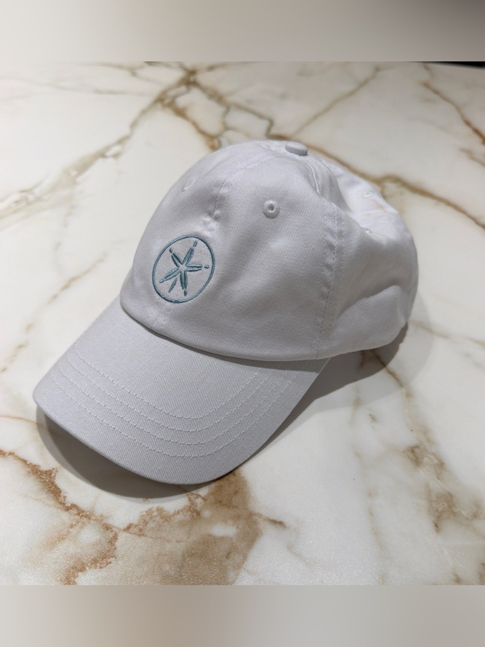 Le Barthelemy White Cap with Light Blue Starburst Embroidery